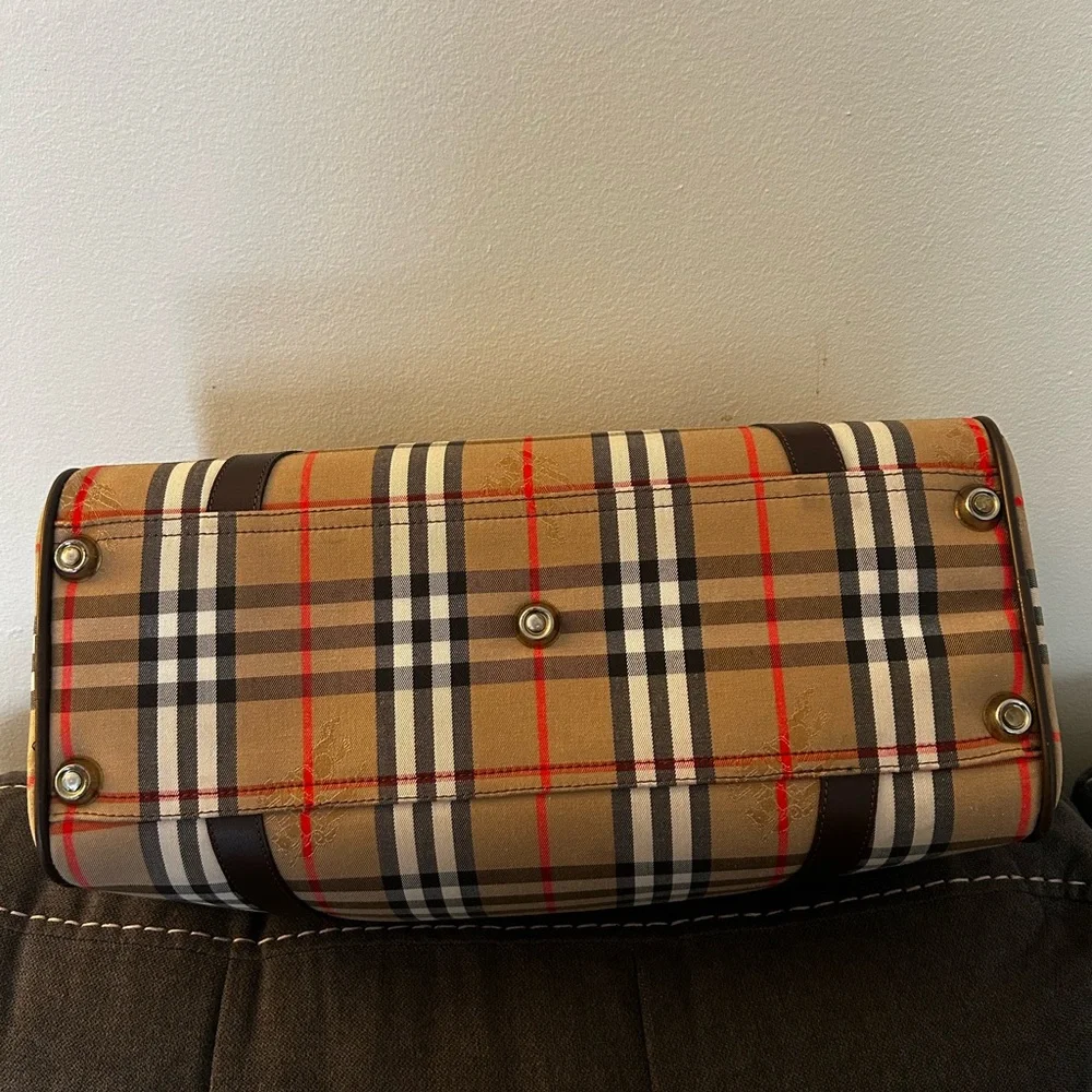 Burberrys Haymarket Boston Tan Duffel with Brown Leather Trim 10H x 19W inches